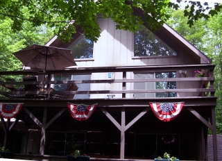 Summer view of Snowman Cabin in Gaylord Michigan.